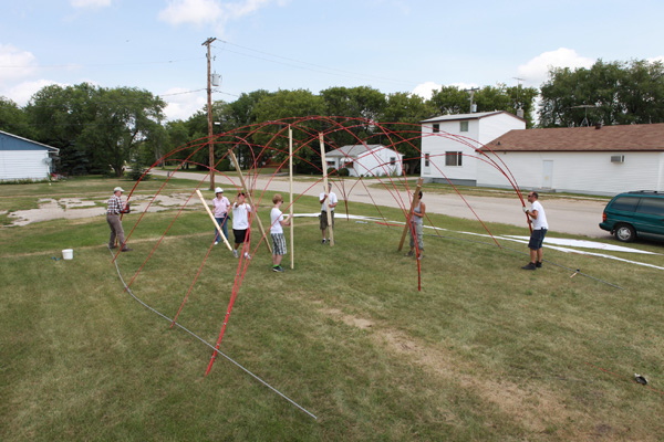 On The Road structure being installed by volunteers from St. Claude, Manitoba