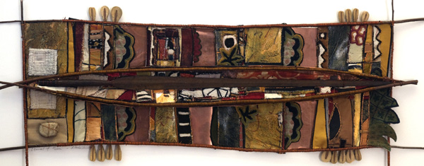 Channel of Peace, found and embellished textiles, acrylic paint, copper, stone, willow branch, wire, authentic Masai spear, 25" X 50", 2012, Photo credit: Mark Vander Vennen