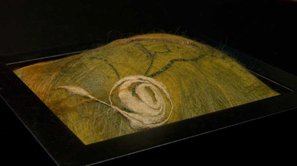 Midden, 2010, 6Hx6Wx3D inches framed, Merino wool, silk roving, handspun cricula silk, Technique: Handmade felt-wet felting. Photo credit: Shawna Eberle.
