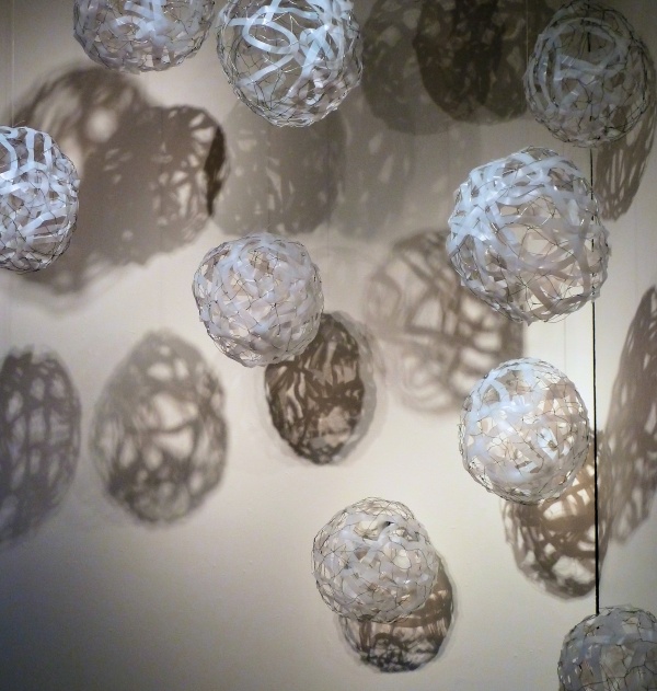Lucid (in process), plastic milk bottles, staples, monofilament, shadow & light, installation: Hanson Scott Gallery, Seattle, WA, photo: Lynn Scott