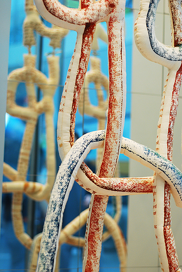 Beginning to Macrame – Interactive Soft Sculpture, 2009, Installation currently up at Pearson International Airport, 274 cm h x 152.5 cm w x 7.5 cm d, Polychromatic screen print on cotton muslin, sewn and stuffed. Photograph: Yan Zhou