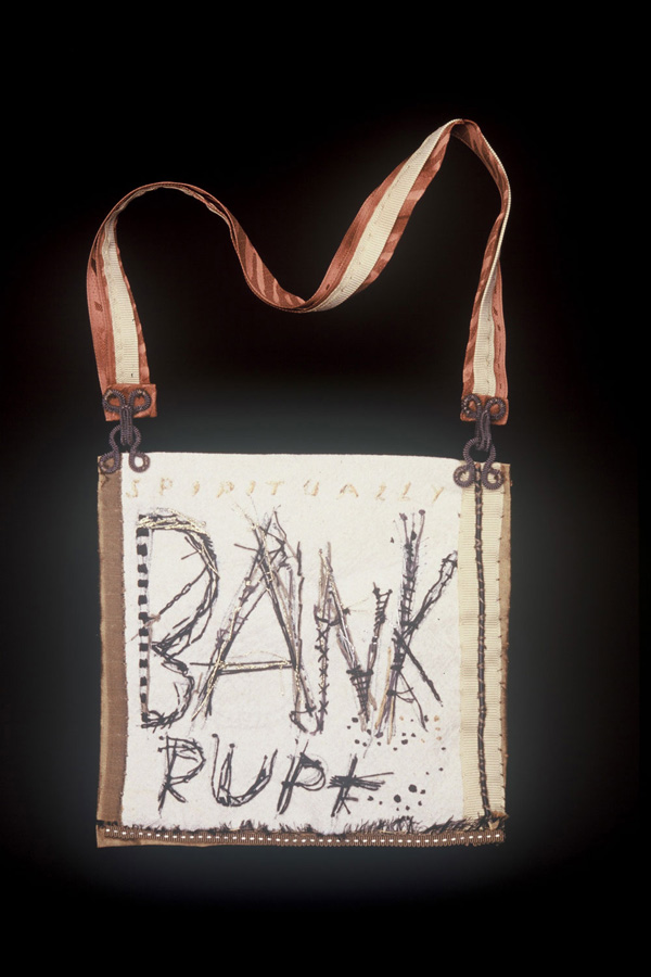 Bank purse. 1996 , 6" x6" Embroidered canvas, ribbon, hardware. Part of 27 Downsized Purses first shown at Prime Gallery, then at Canadian Craft Museum show in Vancouver.