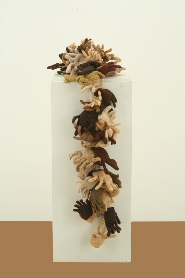 All Hands, 2011, 48" x 10"w x 8" (on top), Knitted Wool, Fulled and Sewn