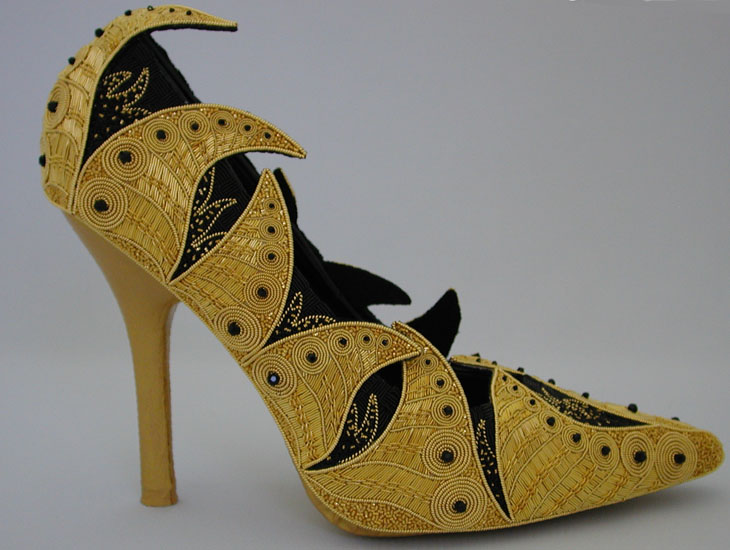 Ashes to Affluence, ready made ladies shoe (size 9), cotton and polyester fabric and threads, metal and metallic threads, wire, leather, acrylic paint, crystals, Contemporary goldwork, 7"hx10"wx4"d.