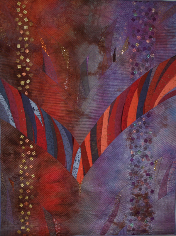 Souvenir d'Alsace (108 x 143 cm), Materials: linen, cotton, silks, beads, organza, lutrador, angelwire, paint, oil crayons, fusible web.

The fabrics for this quilt were purchased in the Alsace at St-Marie-aux-Mines (FR) during the quilting event of 2009. The V-shape is derived from a piece of jewelry that our son has made for his girlfriend.