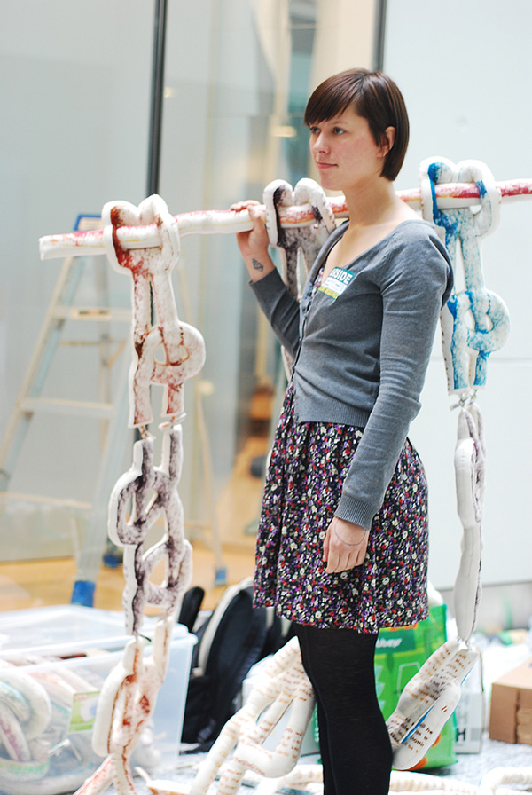 Beginning to Macrame – Interactive Soft Sculpture, 2009, Mounting the installation at Pearson International Airport, 274 cm h x 152.5 cm w x 7.5 cm d, Polychromatic screen print on cotton muslin, sewn and stuffed. Photograph: Yan Zhou