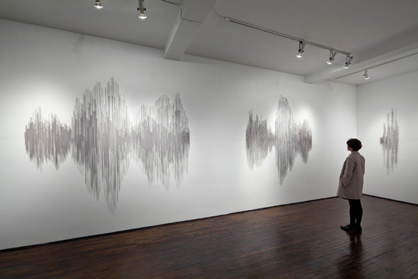 Hesitations, Articule, Montréal, QC. Thread wound around painted nails on drywall; soundscape, 2010, 96"H x 375"W x 1"D, thread construction. Photo: Guy L'Heureux.