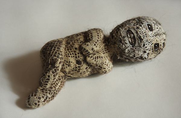 Twin, 13" x 4" x3", 2005, Human hair, prosthetic glass eyes, porcelain, crochet, wire armatures filled with rigid polyurethane foam. Photo: Catherine Heard.