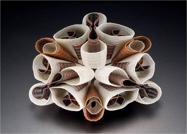 Accentuating Focus, 2006. Nylon monofilament, copper and brass. Quadruple-cloth created on an 8 harness floor loom. 7" x 7" x 3"