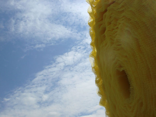 Silage (detail), reclaimed and manipulated water barrier fabric, cotton fabric, found spool, knitting technique, Teton County, Wyoming, 2011.