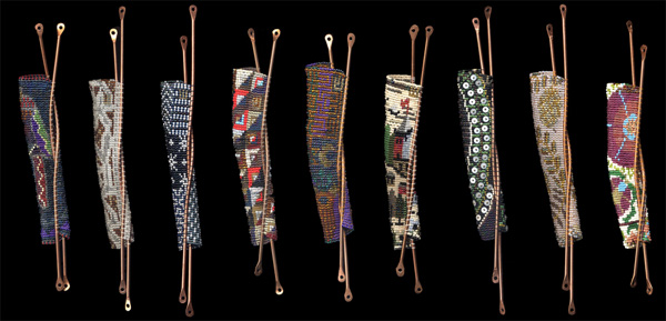 Women's Textiles series of Mezuzah bayit cases. Being a textile artist, it is natural to think of wrapping or enfolding. Just as a mother hugs her child, these mezuzah cases (attached to the doorpost of Jewish homes) embrace the klaf (parchment on which a specific Biblical passage is hand-scribed) figuratively and literally. The idea for this series comes from the experience of wrapping my tallit (prayer shawl) (slide A) around my daughter during prayer service, and the awareness that securing the klaf, teaching our children, and creating spiritual space are related commandments. Women everywhere create clothing and household textiles. This ongoing series is inspired by textiles that women make in various parts of the world.