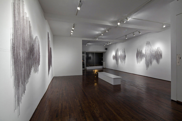 Hesitations, Articule, Montréal, QC. Thread wound around painted nails on drywall; soundscape, 2010, 96"H x 816"W x 1"D, thread construction. Photo: Guy L'Heureux.