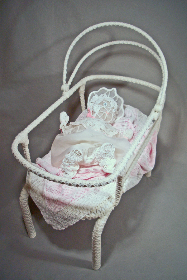 Sister Vicki, 2011, 37"H x 34.5"W x 20"D, Mixed Media Sculpture:  Cotton crochet threads and yarn, silk organza, antique doilies and bedspread, pellon, wire, structural components of found basinet. Crochet, hand stitching, embroidery, mache, wire armature construction