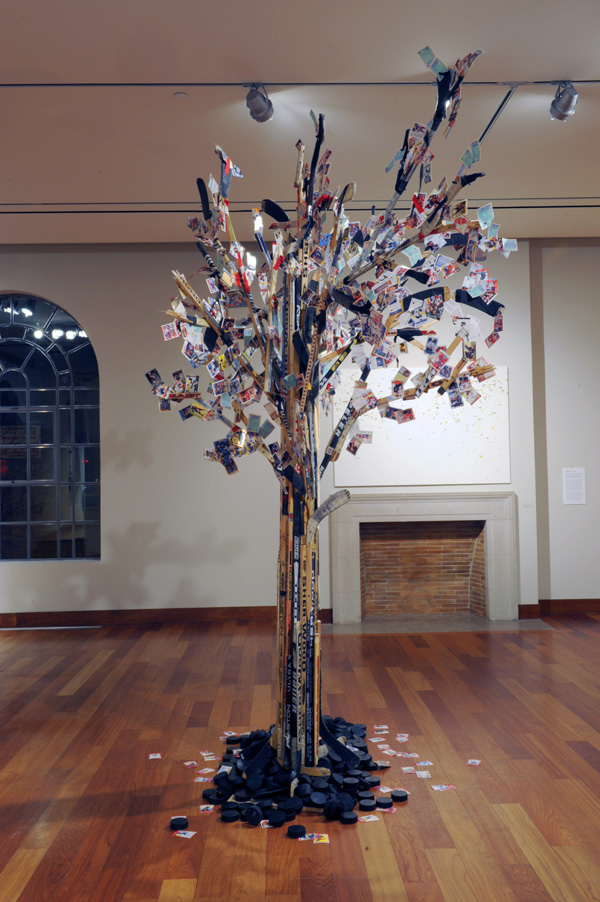 Maple LEAF Tree, recycled hockey sticks and hockey cards on wooden armature, height is 14 feet tall, 2008.