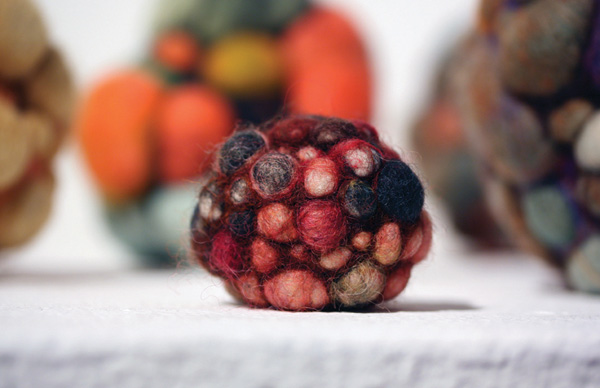 Red Seed – 2.5 x 2 x 1.5 in., needlefelted wool. Photo by artist
