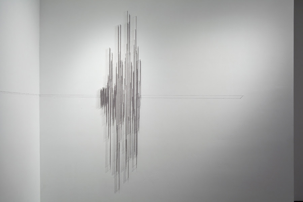 Hesitations, Articule, Montréal, QC. Thread wound around painted nails on drywall; soundscape, 2010, 36"H x 24"W x 1"D, thread construction. Photo: Guy L'Heureux.