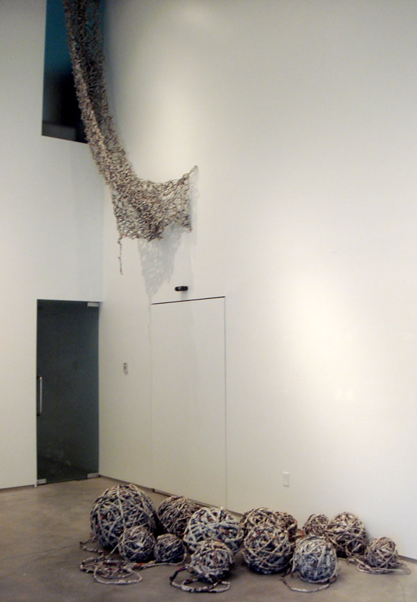 Freefall, 15'x7"x16" approx., newspaper, spinning technique and knitting technique, 2013.