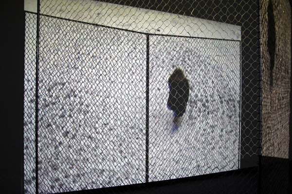 Detail: Open Ended, 2010-2011 sculptural and video installation, elastic net, metal structure, plastic ties, three channel projection, light bulb, drawings (7' x 8' x 8')