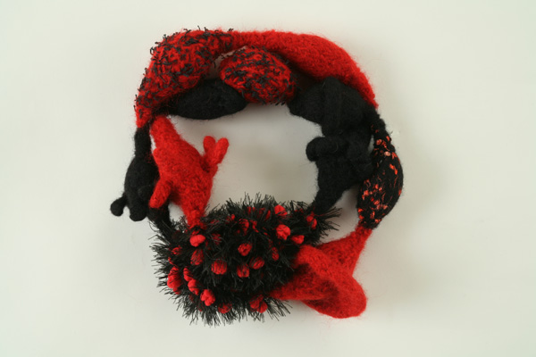 Red and Black Bopple Neckpiece, doubled, 20"L x 2"W x 2"D, knitted wool, and other fibers, fulled, with magnet clasp.
