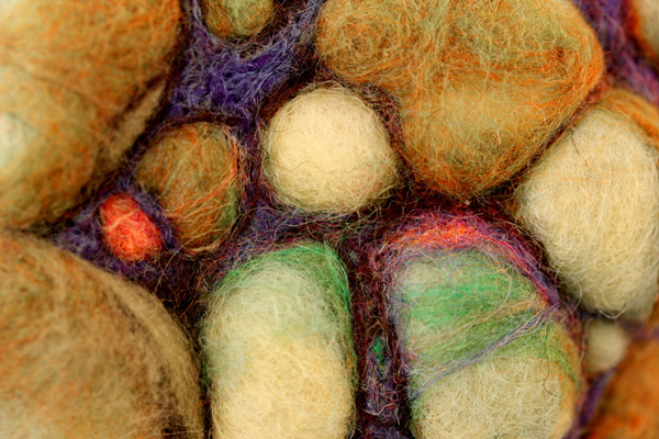 Red Seed – 2.5 x 2 x 1.5 in., needlefelted wool. Photo by artis