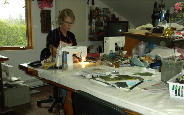 Artist Susan Strachan Johnson, working in studio