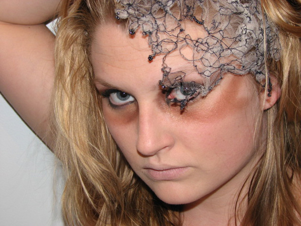 Swarming, 2009, Materials and Techniques: Free motion embroidery on tule, black cotton thread, glass beads, hair clip