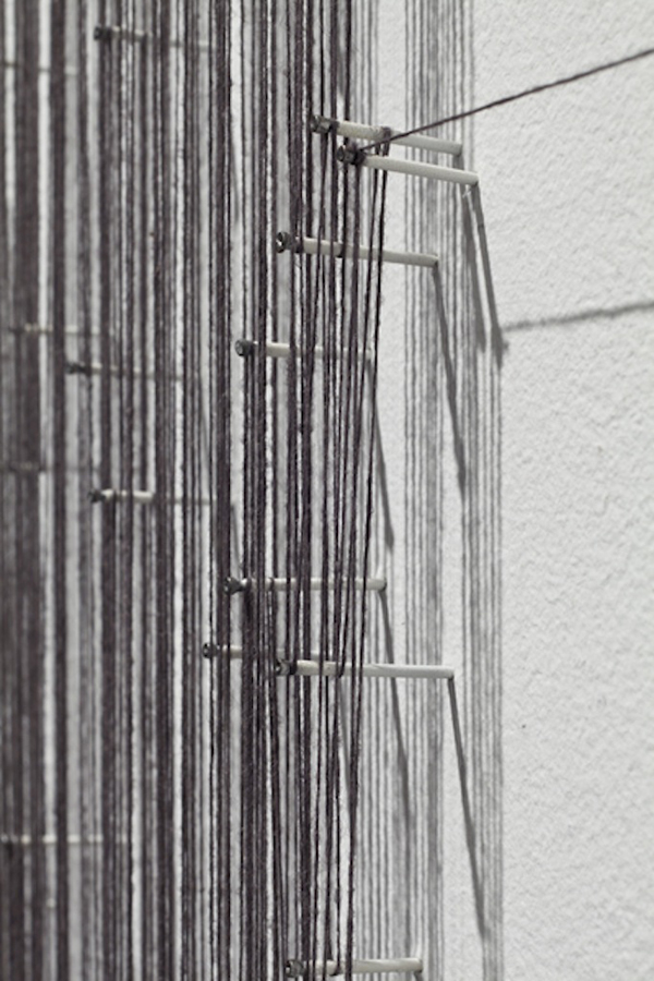 Detail: Hesitations, Articule, Montréal, QC. Thread wound around painted nails on drywall; soundscape, 2010, 12"H x 8"W x 1"D, thread construction. Photo: Guy L'Heureux.