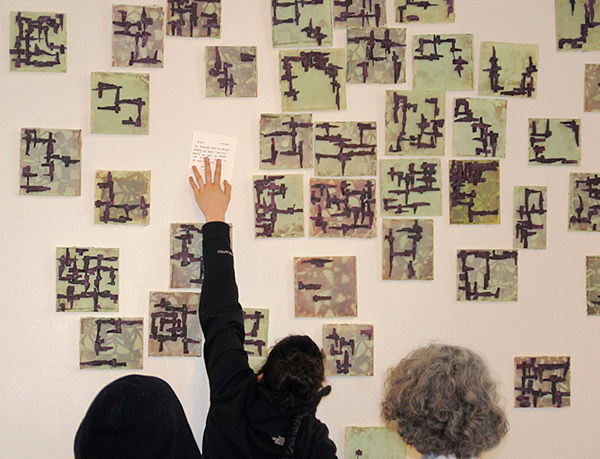Installation view, Partial Floor Plans, dimensions variable, viewer replacing small floor plan of mine with card by her. Photo: Mark Frey.