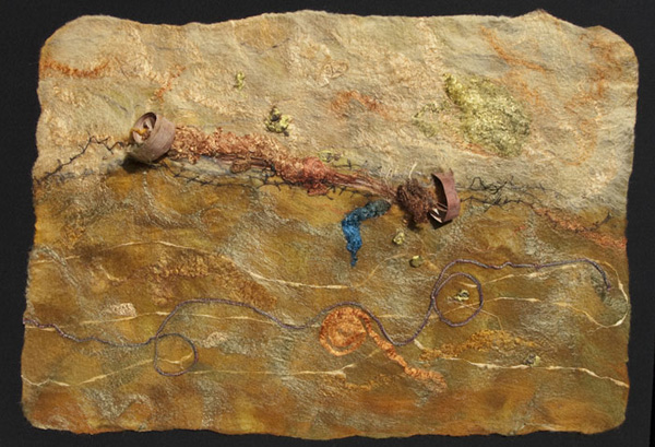 Desertification, 9/2009, 17.5 H x 27 W x 0.5 D inches, Merino wool, throwsters waste silk, silk roving, linen yarn, wrapped Tsumugi silk yarn, embedded organics – birch bark, silk wrapped jasmine dragon pearl tea leaves, catalpa pod. Technique: handmade felt – wet felting. photo: Rod Trider