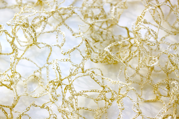 From Rags to Riches – detail, 2010, 101 cm h x 61 cm w x 3.8 cm d, Handspun kozo papers, crochet, konnayaku starch. Photograph: Lizz Aston