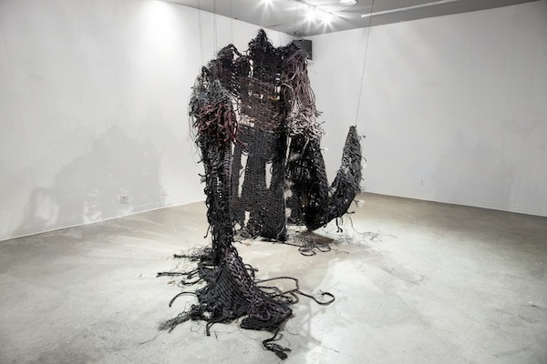 For Lethe, 2014, 8’H x 2’D x 4’W, hand-dyed sisal rope, rusted steel. Technique: Handmade, hand-dyed large-scale weaving loom tapestry using plain & soumak weaves. Photo: Miles Collyer.
