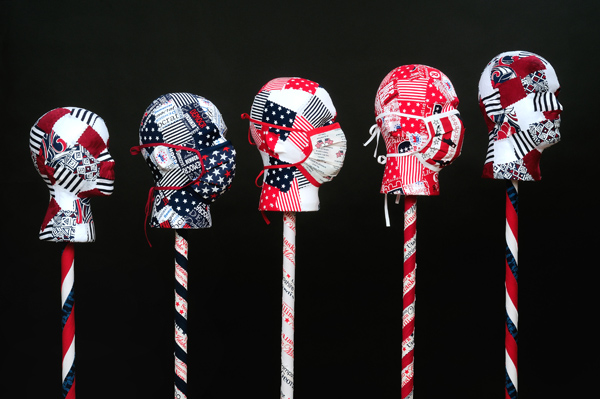 Stand! #8, Protest Series, detail. Installation 52 stands/heads, Styrofoam, dowel rods, wood, commercial fabric, Decoupage, machine piecing, paint, 2011 Size Variable, Photo: Tom Fitzpatrick