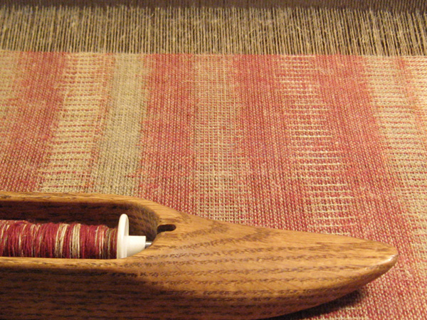 Recollect 1 on the loom, Linen threads dyed with madder using kasuri technique. Photo: M Kelly-Frère.