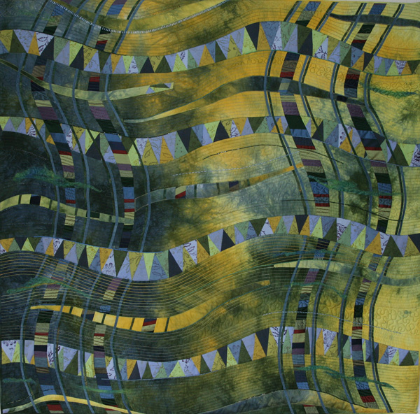 Layers (128 x 128 cm), Materials: cotton, silks, linen, beads

Because I did not want to cut a beautiful hand dyed fabric in pieces, I put layers of silk and linen in between. The silk layers are supplemented with bias of batik fabric. The remains are appliquéd resulting in a nice light / dark contrast. On the sides the blue-green silk forms a new layer. In addition, the quilting creates final layers. These are again accented with beads and metallic thread embroidery.