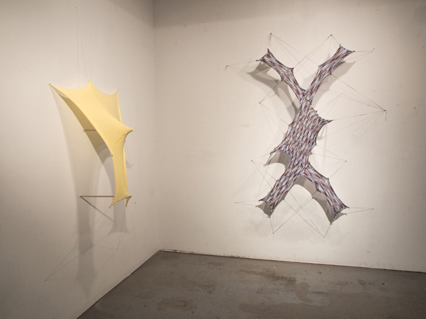 Stretched to my limits, how soon is now, Left work, yellow: 79 inches high x 36 W x 18 D, Right work: 90 inches high x 42 W x 18 D, Knitted yarn, wood, nails, 2013. Photo: Andrew MacDonald.