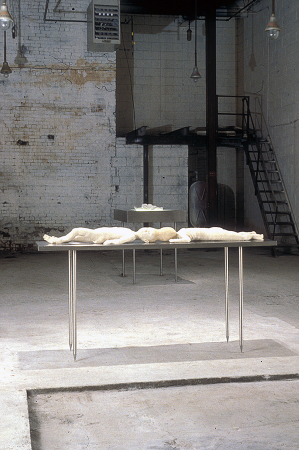 Confessional, size variable, 1996, Duratrans, light box, hand sewn figure, christening gown, photo mural, figure sewn from wedding dress, human hair, sound. Original installation with Nether Mind Artists' Collective, Toronto. Photo: Simon Glass. Collection of the Kamloops art Gallery.