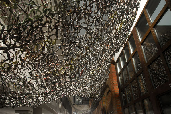 Magic Carpet Ride, 80'x12'x15', newspaper, spinning technique and knitting technique, Lodz, Poland, 2011