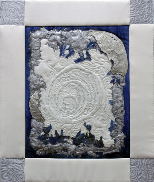 Heart Song, 2011, 18.5" (h) x 16" (w), Materials:  Cotton; Various synthetic textiles; Fusible web; Heat Away stabilizer; Acrylic textile paints; Metallic pen; Encaustic crayon; Pewter; Tulle; Various threads; Mounted on fabric wrapped wooden frame, Techniques:  Free Motion Embroidery; Rubbing; Thermo-fabrication (heat applied), Hand stitching
 
Artist Statement:
Sometimes I just feel an overwhelming, calming connection to things around me, and I write down my feelings, and make art to go with it. "Heart Song" is the result of one of those sessions. There is a strong sense of touching the beyond, while grounded in the reality of the process of creating. Time is lost - I am lost, and yet found. 
Why do I need to understand in my head when often - more than often I am able to design artwork, over and over, with you as the central figure? Once I began thinking with my heart I used my inner eye to see the real you among the others. You present yourself to my consciousness as a halo of light allowing me to explore the darkness without fear, letting my inner being, my true self radiate and grow until my heart overflows
 