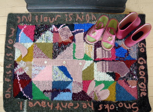 "Mi Pinks", recycled yarn and clothing on a burlap backing; rug hooking, 61 x 91 cm (24 x 36 in). In this 'Brin and Boots' series I create from yarns and fabrics stories of Newfoundland. Knitting is often a first use of virgin threads; felting and rug hooking are an end stage for individual fibres, and yet a 'community' of incredible resilience and usefulness. These fabric relics take a form resembling hooked rugs and rubber boots, to reflect on the textile vernacular, personal songs and stories, and spirit of Newfoundland's people and place. The fictional story behind this rug:

"For my 12th birthday my Aunt Vera, who lives in Harvey, NB , knit me a pink sweater with pearl buttons and matching mitts and socks. They were the first matching outfit I ever had, and the first not made from our dull, scratchy homespun. And they were my pride and joy. I wore them even when they shrank . . . or I grew, and the town kids of course teased me about 'Me Pinks', except for Georgie Snook, who pretended to admire them, even though he really only wanted to get inside them. Now I am a hairdresser in Dartmouth, far away from family and town, but also away from the poorness and fishing. I have some decent clothes for work and play, but still fondly remember 'Me Pinks', even though they are probably now wiping rags or cut up for rugs."