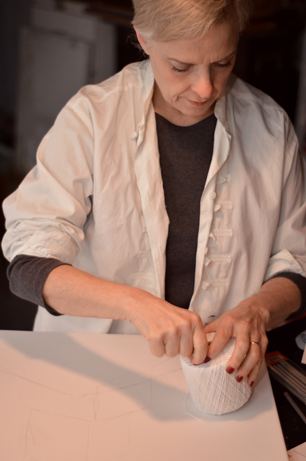 Karen working on Archive, 36" x 48", Thread and acrylic on stretched canvas, embroidery. Photo: Meghan Brondos.