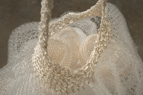 Full (Basket), 2011, 66" x 12.5" x 16.25", Monofilament, thread, iron, silk. 
Technique crochet. Photo: John Carlano.