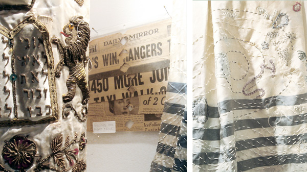 Tales from the Geniza [place to collect damaged/discarded sacred or heretical texts]: Mrs Harry Goldman. Mixed media; objects from the Jerusalem and San Francisco genizas, photos: Paul Kay. 

An ongoing series of works that juxtapose and creatively intervene in objects from several geniza sites around the world to tell their [fictional] stories. The pages from the New York Daily Mirror (December 27, 1937) were used as wadding behind the right-side commandments tablet. For example:

"Although the provenance of most geniza objects is not known, this group is clearly identified. Harry Goldman died in 1936 at age 72 when he was unable to get out of his house during a fire that started when he was trying to surprise his wife with dinner. Mrs. Goldman arrived home just after the fire crew put out the flames in the entrance and were searching for Harry. As she followed them into the house, she grabbed his water-soaked tallit [prayer shawl] bag on the hall table and clutched it throughout the tragically unfolding ordeal. On Harry's first yahrzeit [anniversary of death] Mrs. Goldman presented the congregation with a Torah mantle. It was only after this well-used cover was retired to the geniza that the full extent of the gift was revealed: Mrs. Goldman, a member of the local Pomegranate Guild, had obsessively embellished the tallit's water stains, embroidered a very personal message to Harry, created a hidden pocket out of the tallit bag, and sewn it into the lining of the mantIe. This way Harry could continue to be in regular attendance at the services he so loved."