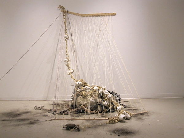 Enveloped, 2013, 10’H x 6’D x 43’W, Sisal, hand-dyed cotton rope, wood, nails, found pulleys. Technique: Handmade, hand-dyed large-scale weaving loom using only a warp. Photo: Mary Grisey. 