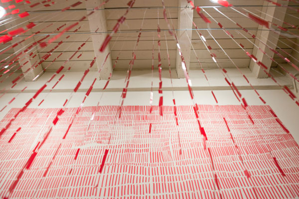 Flow, machine sewn Rubylith® suspended in front of wall drawing, alternative view, marker, plastic, tulle, 2012, 15' x 10' x 4' Photo: M.M. Murphy
