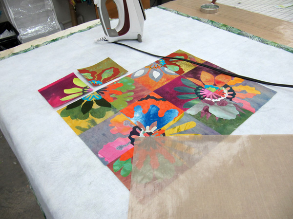 Studio view of ironing station with a fabric collage underway