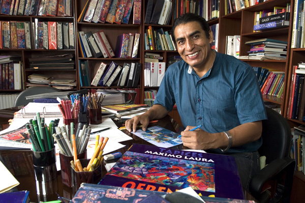 Maximo Laura sketching in his studio.