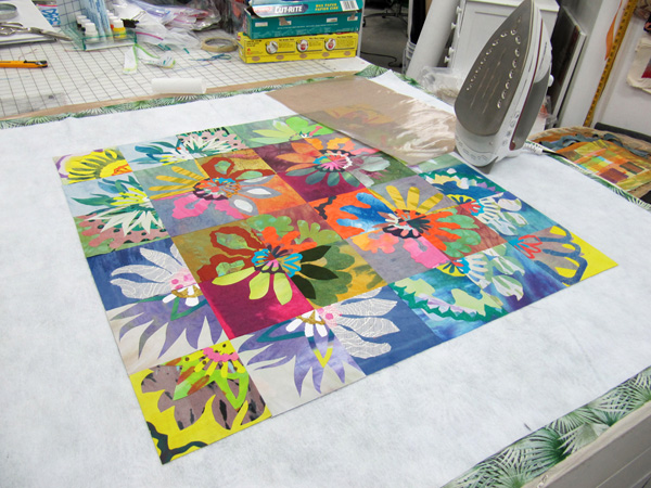 Studio view of ironing station with a fabric collage underway