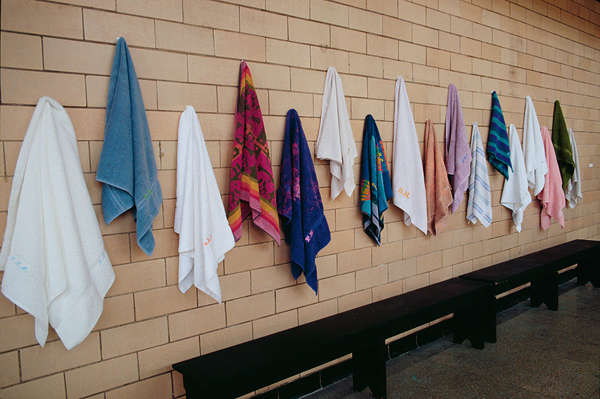 Return, Bain St-Michel, Montréal, QC. Embroidered initials on collected towels, 2004, 59"H x 155"W x 4"D, embroidery. Photo: Arianne Shaffer.