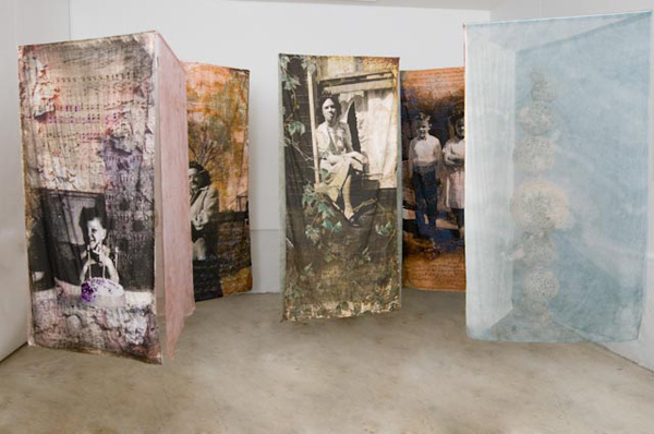 "Vignettes of a Family", (View 1) Digitally collaged photographs on cotton muslin, hand embroidered and machine stitched, dyed silk organza, stiffened yarn, 2011.