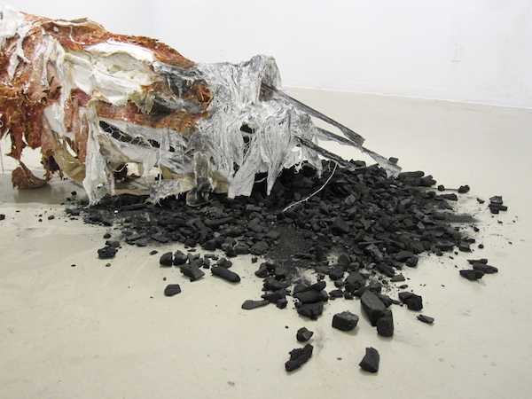 Lest She is Forgotten, detail, 2012, 2’H x 6’W, plaster, chicken wire, upholstery fabric, foam, wood, charcoal, house paint, sisal. Technique: Wood, plaster & chicken wire armature with ripped layers of upholstery fabric. Photo: Mary Grisey. 